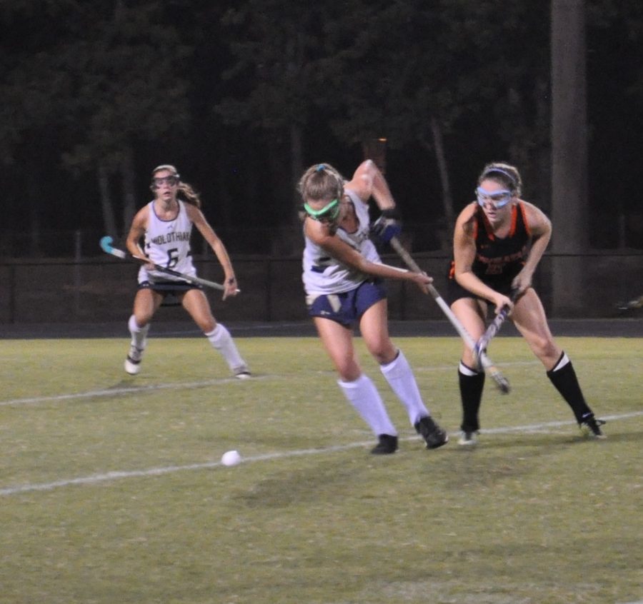 Ava Hammond hustles to gain possession of the ball in the game against Powhatan. 