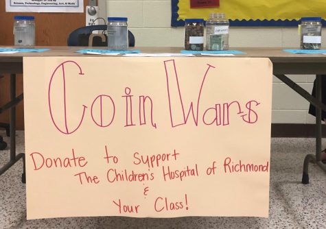 The Coin Wars table encourages all students to donate  to Childrens Hospital of Richmond.