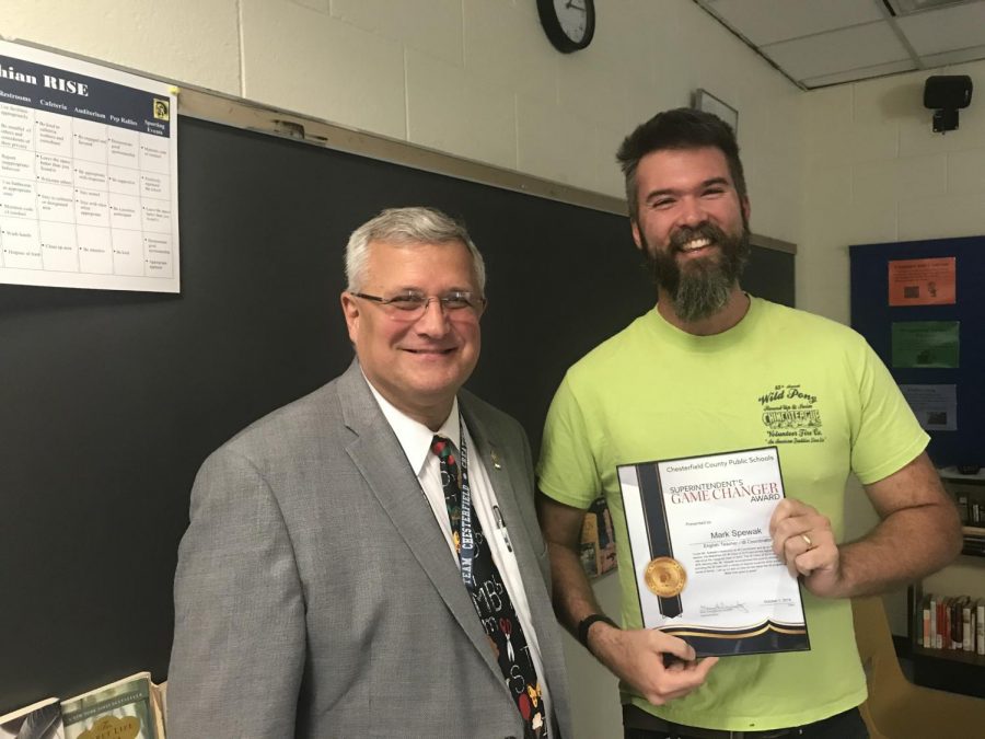 Mr. Mark Spewak receives the Game Changer Award from Superintendent Merv Daugherty.