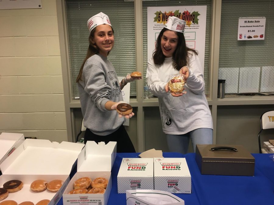 Mary Carson and Noelia McCaffery serve donuts at the IB Election Day Bake Sale.