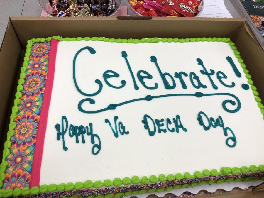 Midlo DECA celebrates VA DECA Day with a cake.