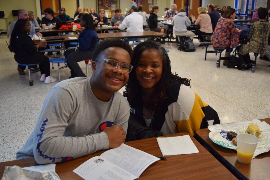 Cameron Penn enjoys time with his mother at the 2019 RISE breakfast. 