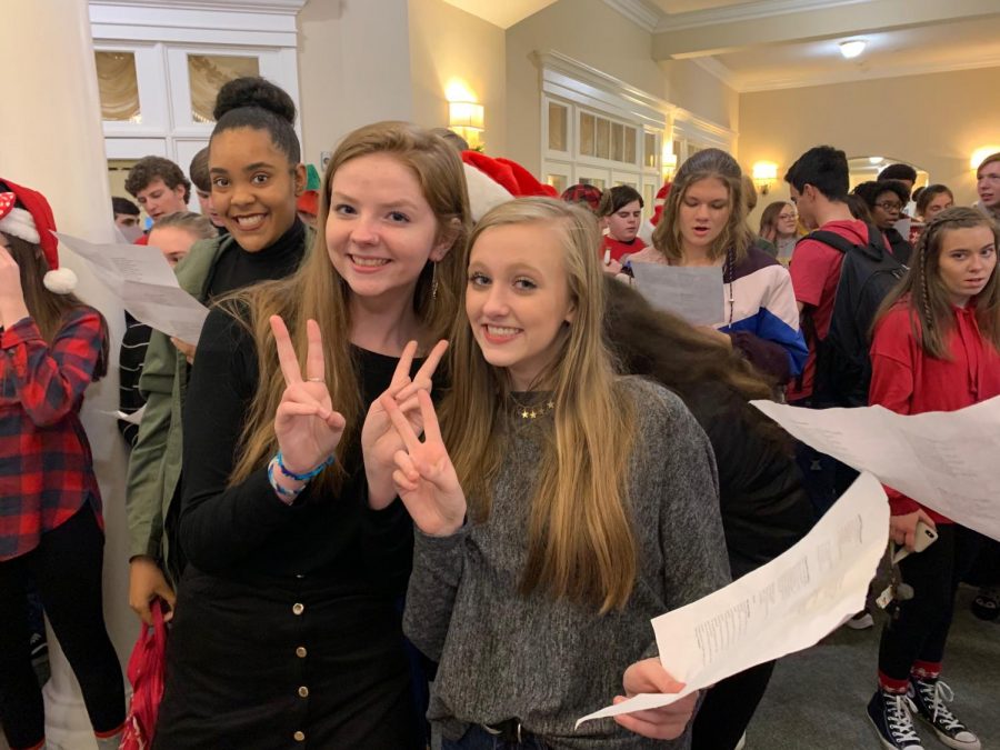 Kaija Taylor, Cassidy Shelton, and Whitley Glidewell prepare to sing Christmas carols to the residents of Spring Arbor.