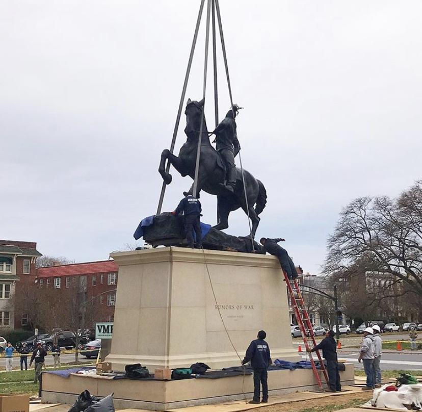 A helicopter placed Rumors of War on its pedestal at the VMFA. 