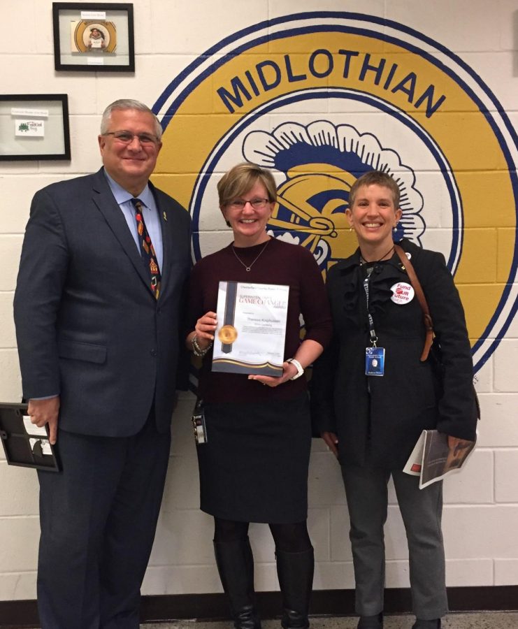 Mervin B. Daugherty and Kathryn Haines awarded Theresa Kniphuisen the CCPS Game Changer award at Midlothian High School.