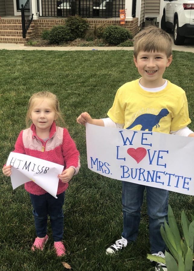 Jude Hill, joined by his little sister Wren, show their love for J.B. Watkins kindergarten teacher Mrs. Kathy Burnette at the Watkins staff parade on March 24, 2020.