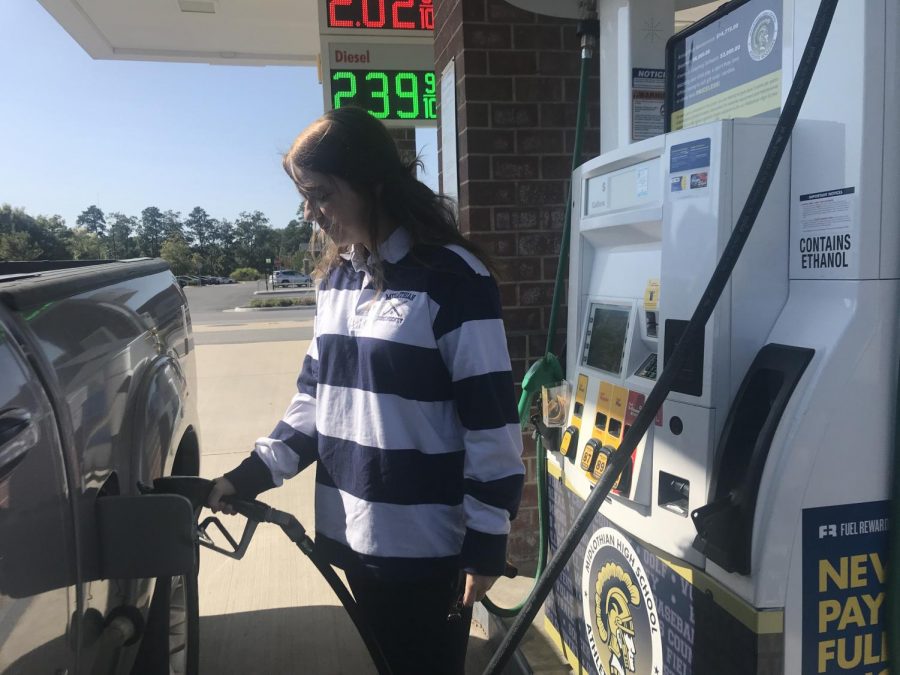 Kaitlyn Moore, a member of the Midlo Field Hockey team, supports the Midlo Boosters by filling her tank with gas from Pump 8 at the Charter Colony Shell station. 