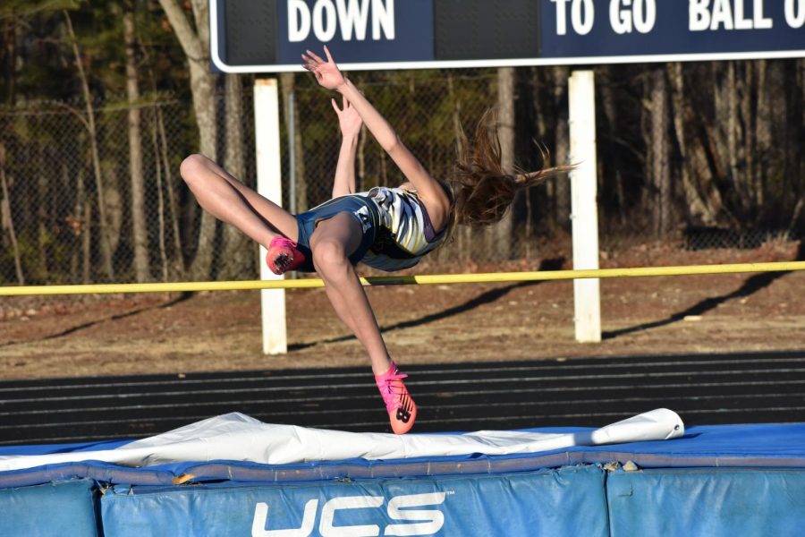Ella Young, freshman, clears the high jump bar.