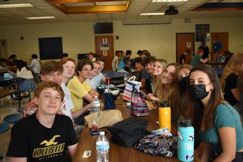 Midlo students catch up on the past year with one another over school lunch.