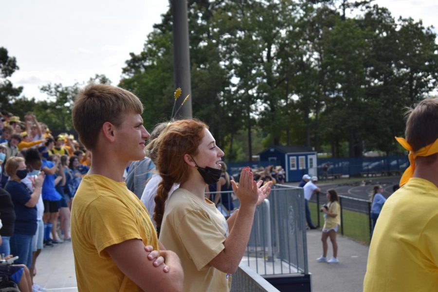Sophomores Thomas Ludin and Skye Quina cheer on their class. 
