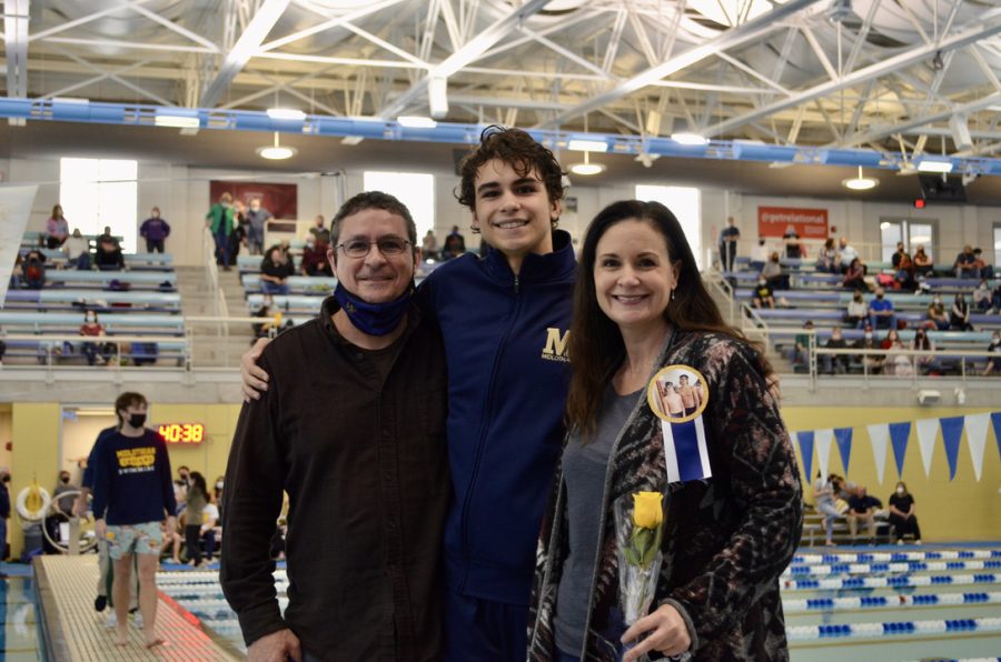 Jackson Trebour and his family appreciates his last swim meet as a Trojan. 