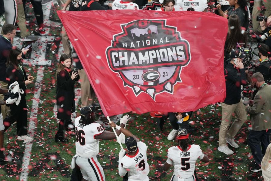 Georgia+players+celebrate+with+their+championship+flag