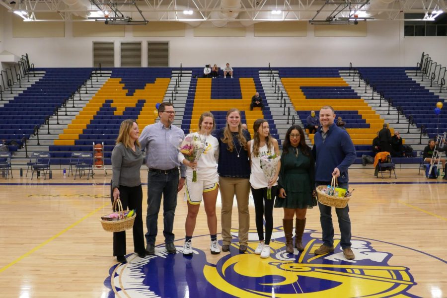 The senior girls basketball players celebrate with there families and coach.
