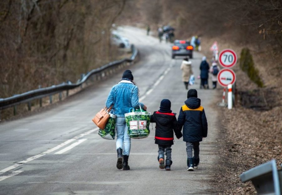 A woman with two children leave Ukraine after crossing the Slovak-Ukrainian border in eastern Slovakia.