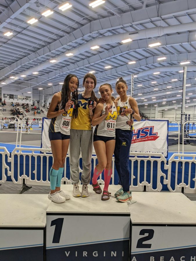 The+4x400+team+finds+sucess+in+their+event.+%28Alternate+Cora+Corcoran+pictured+instead+of+Kylie+Bonser%29