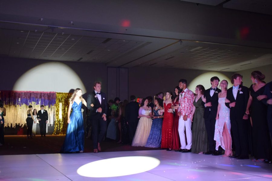 Students+strut+down+the+dance+floor+as+Mr.+Johnson+announces+the+Prom+Court.