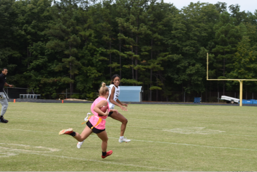 Senior Madelyn Ratdke runs the ball.