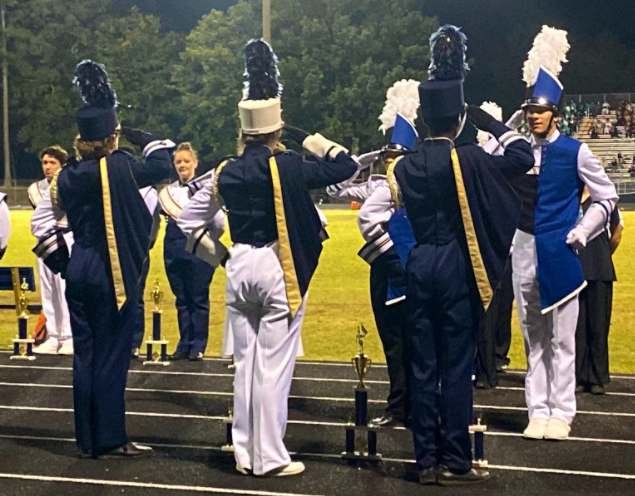 Drum Majors Taj Davis, Kate Tabor, and Jacob Williams present the Atlee Marching Raiders with their well-earned awards.