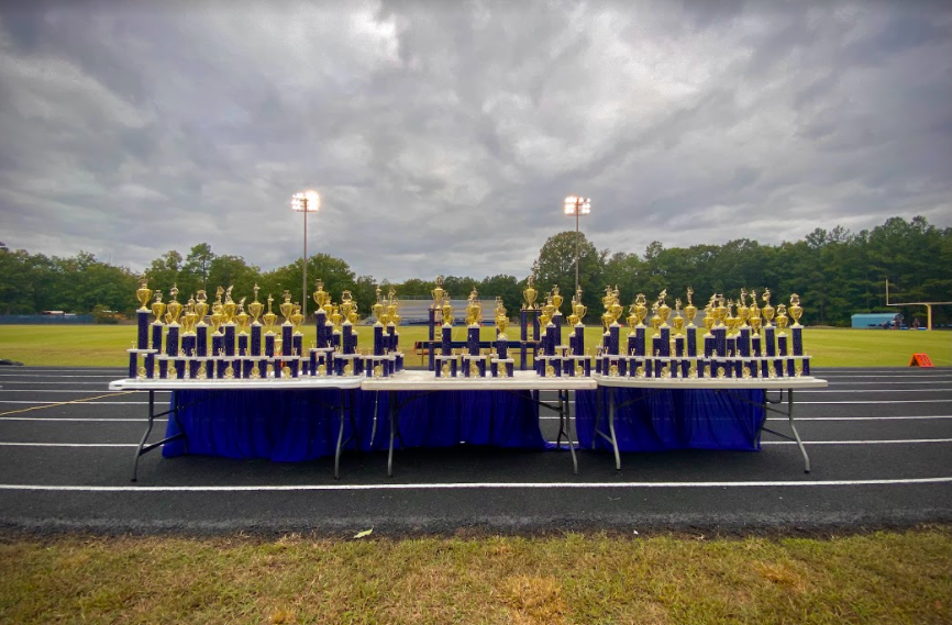 Midlothian displays the showcase trophies before the event while storm clouds loom overhead.