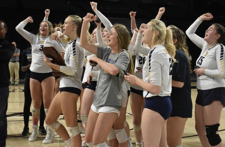 Varsity Girls Volleyball celebrates their victory in the State Finals.