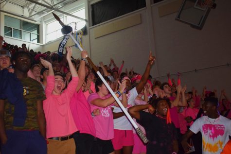 Seniors cheer for their class with the spirit stick  