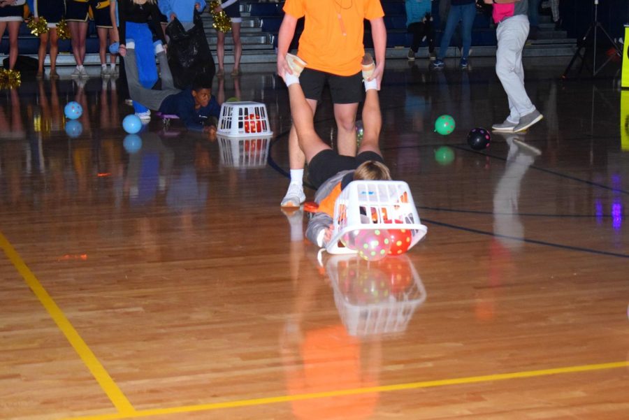 Classes compete in a game of Hungry Hungry Hippos.