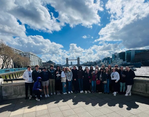 Students pose in front of the Tower Bridge in London. 