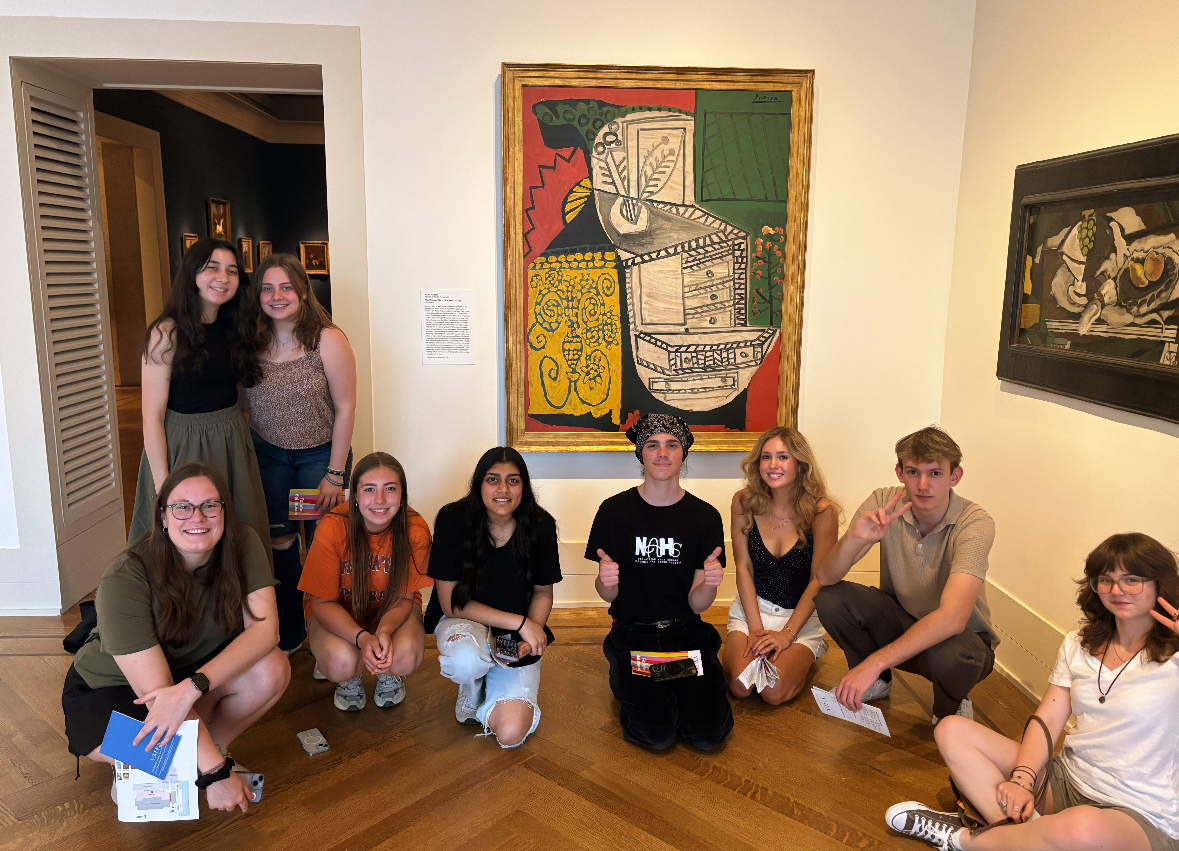 Students posing in front of one of Picasso's paintings at the field trip.